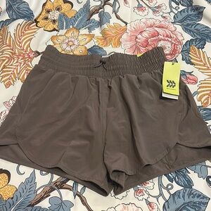 Womens running shorts multiple sizes NWT pockets drawstring - in taupe